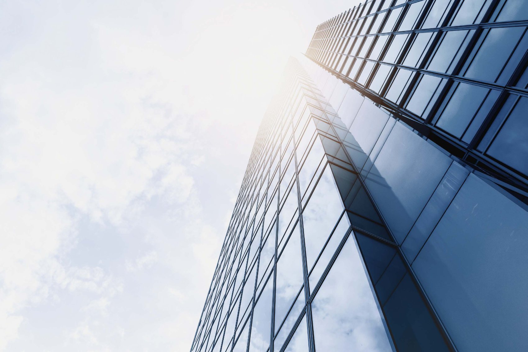 Modern glass tower catching the sun